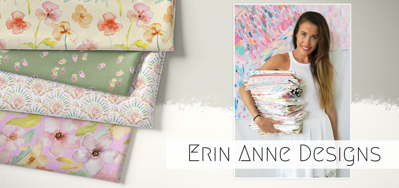 Folded floral, strawberry, and geometric print fabrics beside a smiling woman in white holding a stack of colorful fabrics, with text 'Erin Anne Designs'