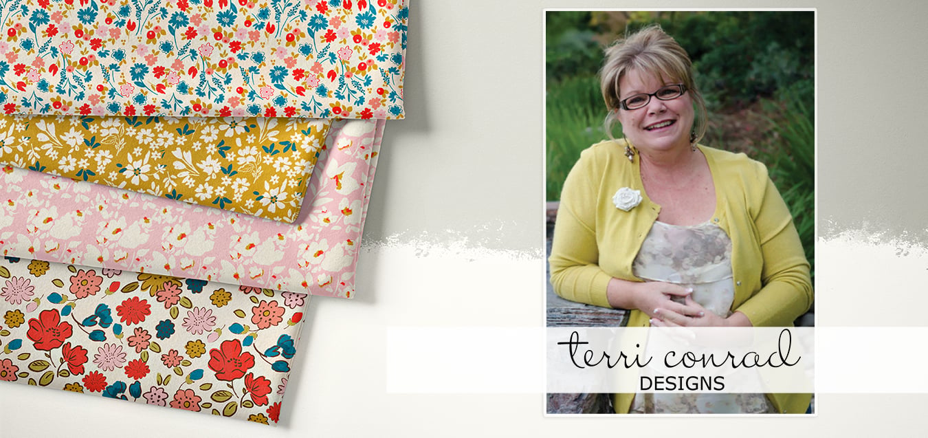 Folded floral fabrics in gold, pink, and red florals beside a portrait photo of designer Terri Conrad in a yellow cardigan