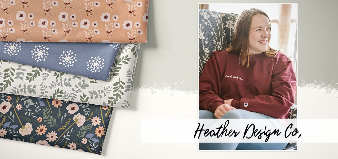 Folded floral fabrics in peach, blue, cream, and navy prints beside a photo of a woman in a maroon Heather Design Co. sweatshirt