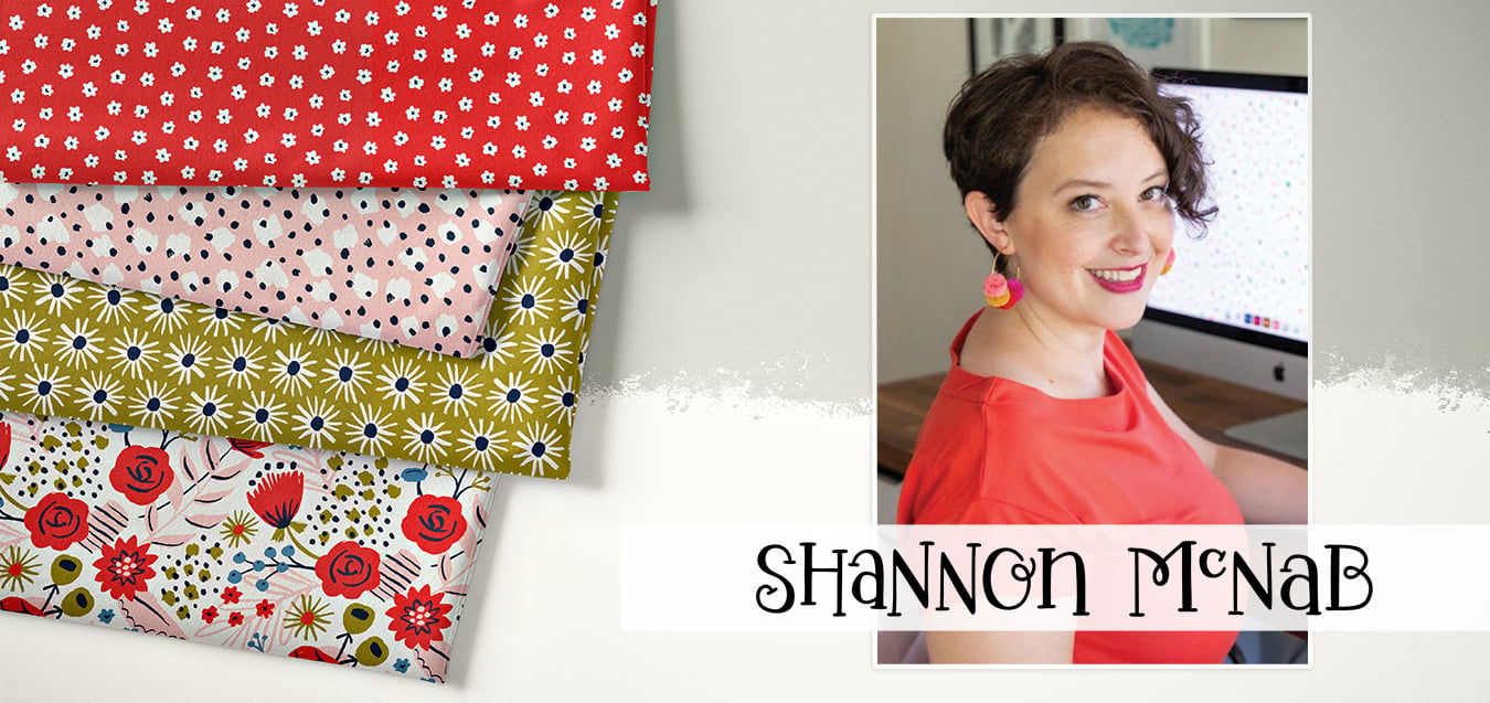Folded fabrics in red floral, pink dot, olive daisy, and floral prints beside a portrait of designer Shannon McNab in a coral top