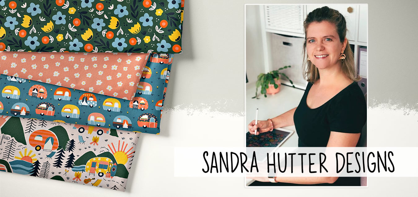 Folded fabrics with floral, camper van, and mountain camping prints beside a photo of designer Sandra Hutter at her desk