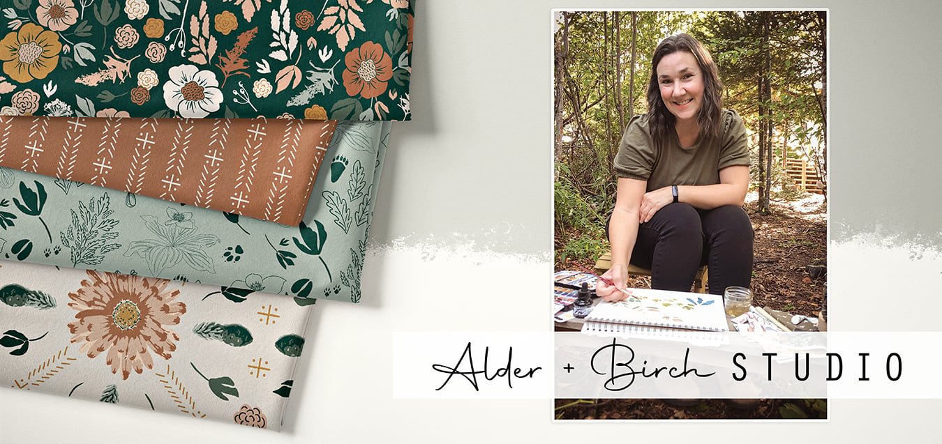 Folded fabrics with floral and nature prints in green, rust, sage, and cream, beside a photo of a woman painting outdoors for Alder + Birch Studio