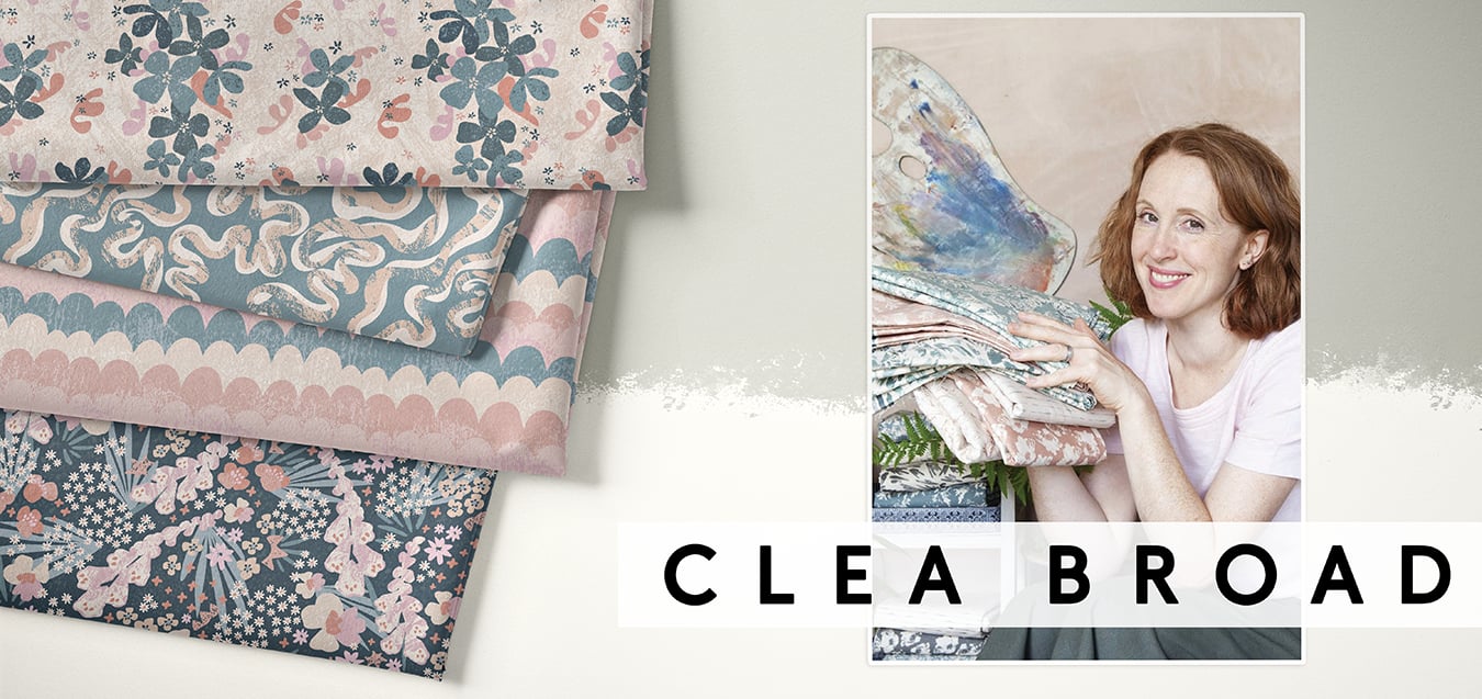 Folded fabrics in floral, wavy, and scallop prints in pink and teal, beside a portrait of designer Clea Broad holding fabric swatches