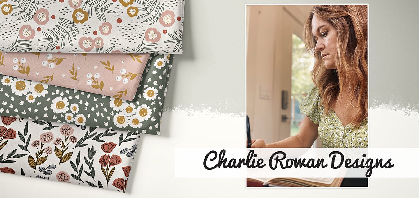 Folded floral fabrics in pink, olive, and cream tones beside a photo of a woman sketching designs, with text "Charlie Rowan Designs"