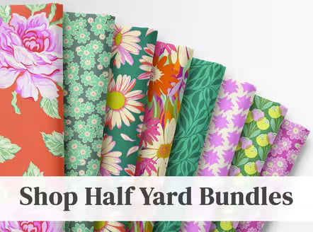 Fanned fabric swatches in floral and leaf prints, orange, green, pink, and purple, with text 'Shop Half Yard Bundles'